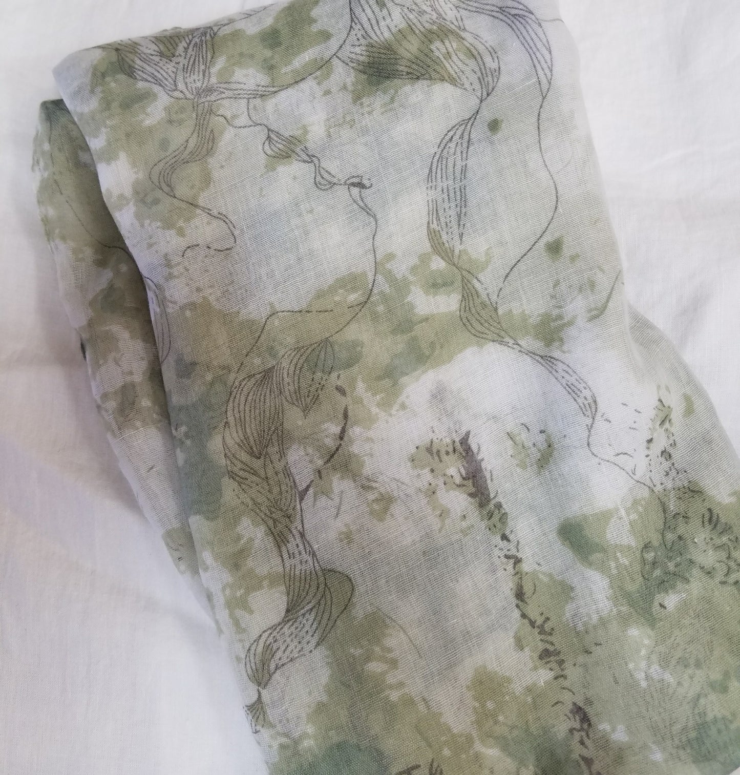 Green scarf with sketching