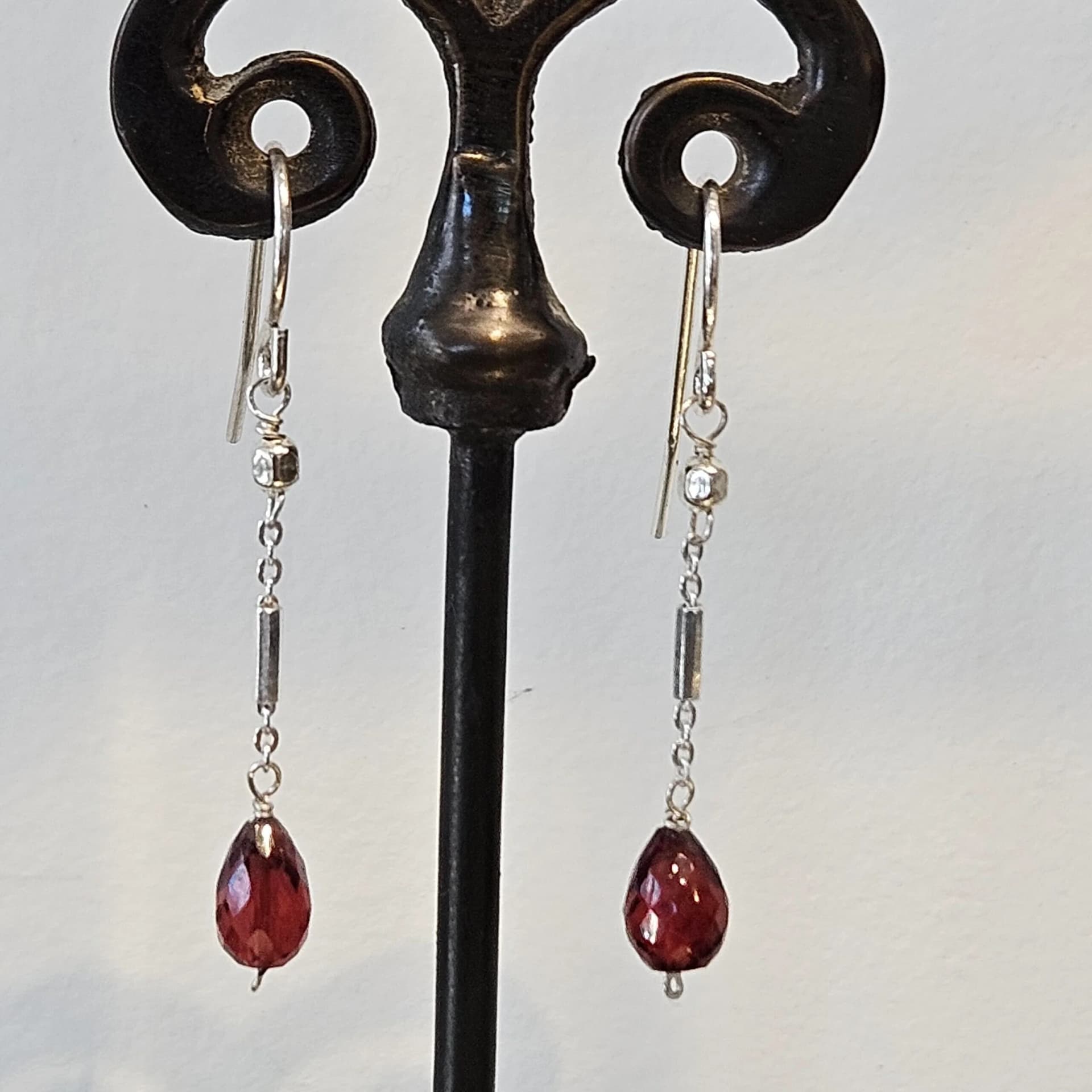 Faceted garnet teardrop earrings on sterling silver chain drops