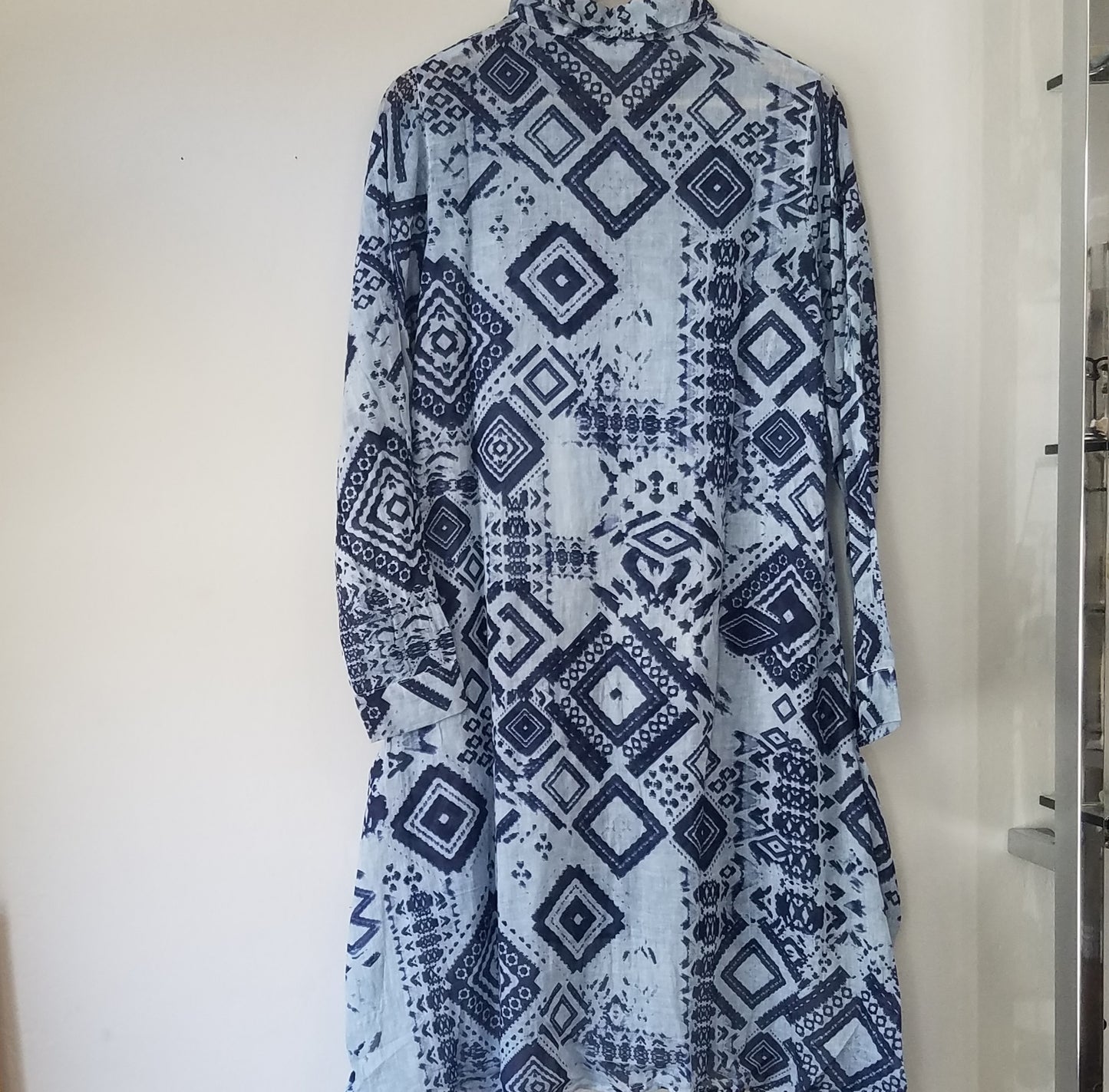 Coral seam on blue tunic