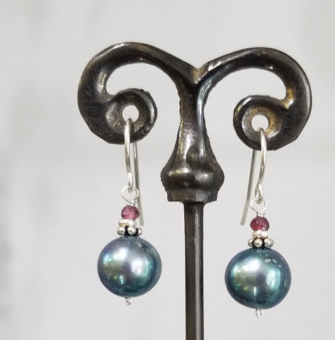 Lustrous blue pearl and garnet earrings