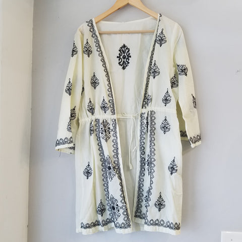 Black embroidery on ivory color tunic